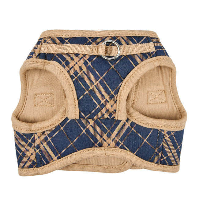 Chaleco para perro con estampado a cuadros en tonos azul y beige. El diseño incluye un sistema de doble cierre con velcro y hebilla para asegurar un ajuste cómodo y seguro, ideal para perros pequeños y medianos.