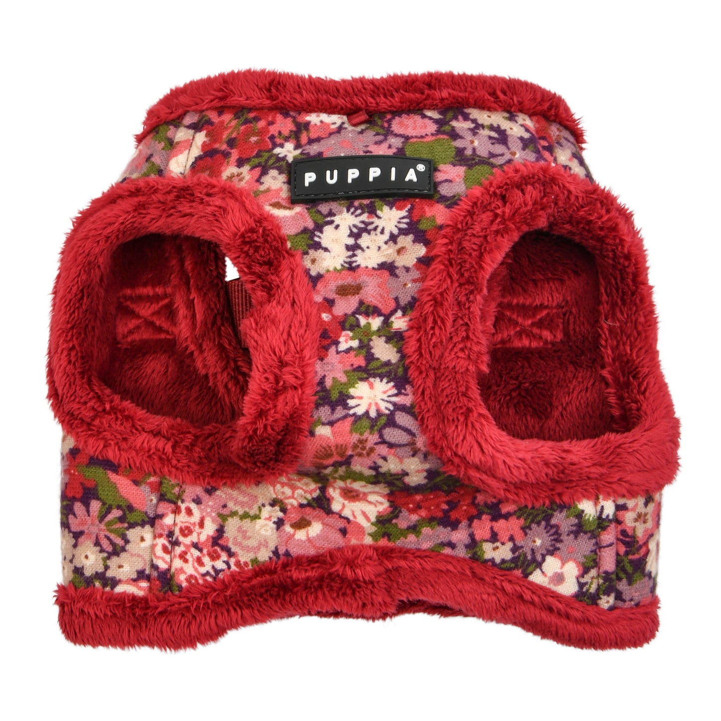 Detalle del sistema de velcro y hebilla del arnés chaleco Florent Puppia, asegurando un ajuste firme y fácil de colocar.